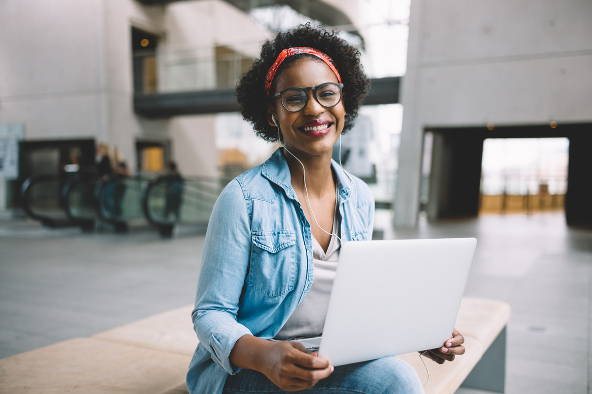 Smiling African Entrepreneur Working Online 